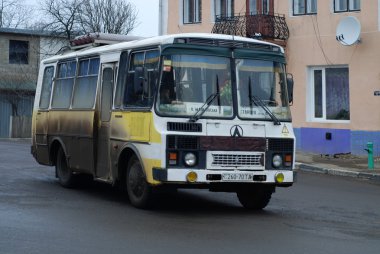 Old bus in city Mosciska, Ukraine. clipart