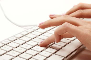 Hand typing on a keyboard clipart