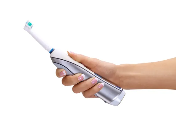Hand holding electric toothbrush — Stock Photo, Image