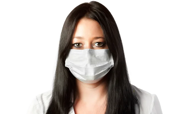 Attractive female brunette nurse in mask isolated on white background — Stock Photo, Image