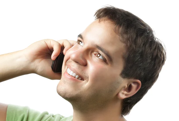 Sonriente joven hablando por teléfono móvil aislado en blanco —  Fotos de Stock