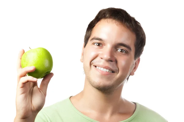 stock image Young smiling man holding green apple isolated on white background