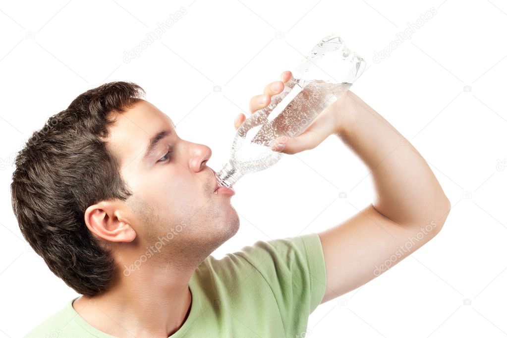 Young man drinking water from bottle isolated on white background