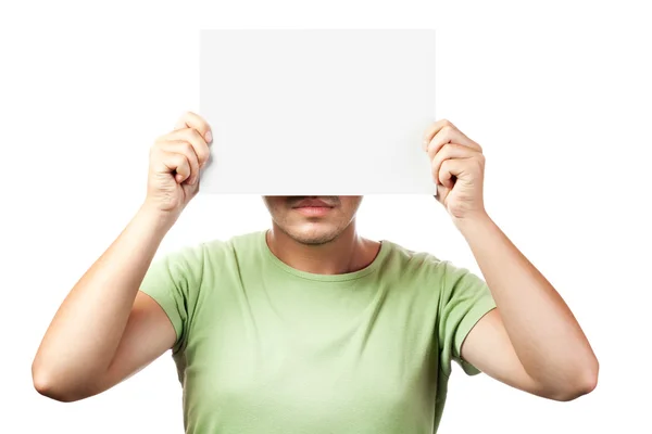 Νεαρός άνδρας που κρατά μια λευκή πινακίδα απομονωμένη σε λευκό φόντο — Φωτογραφία Αρχείου