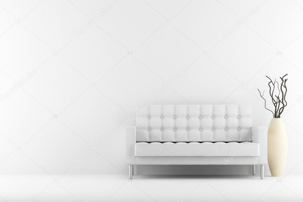 Leather couch and vase with dry wood in front of white wall