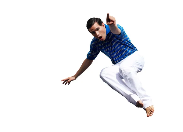 Молодой парень в прыжке с протянутым пальцем — стоковое фото