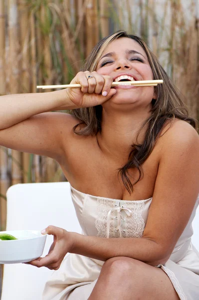 Beautiful woman with sticks — Stock Photo, Image