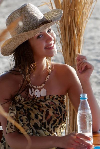 Young and very attractive woman with straw hat — Stock Photo, Image