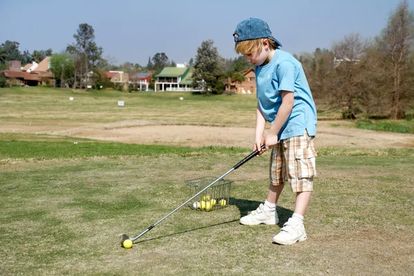 The little boy on a golf field — 스톡 사진