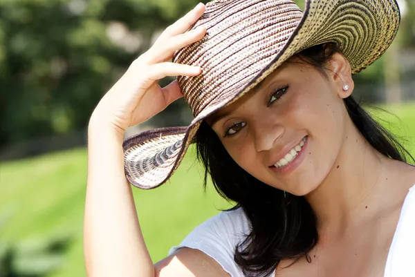 The beautiful Colombian girl in a hat — Stock Photo, Image