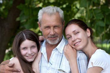 Happy grandfather, daughte and granddaughter outdoor clipart