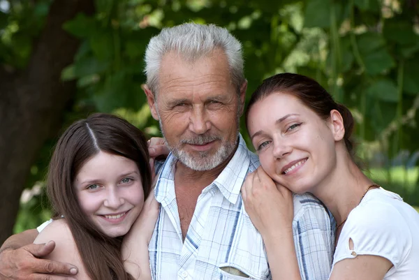 Happy grandfather, daughte and granddaughter outdoor — Stock Photo, Image