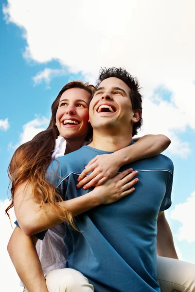 Happy Young couple against the sky Royalty Free Stock Images
