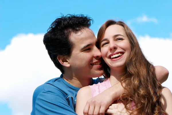 Happy young couple against the sky — Stock Photo, Image