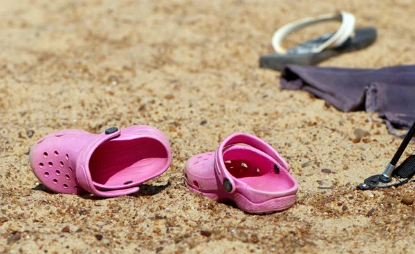 Summer slippers in sand — Stock Photo, Image
