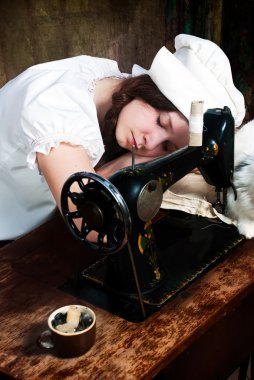 The sleeping young seamstress after wearisome work clipart