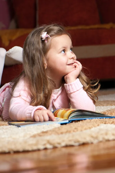 Sweet little girl reading book — Stock Photo, Image