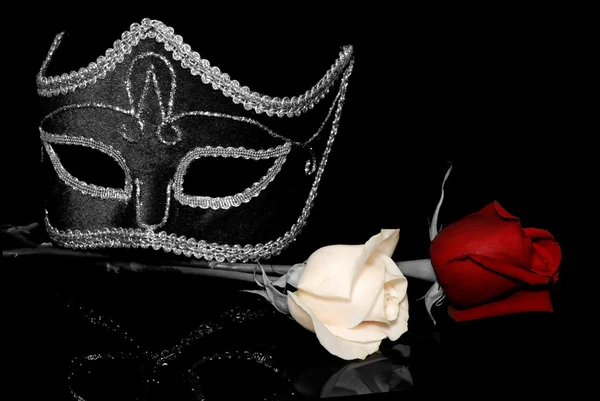 The flowers and Venetian mask on a black background — Stock Photo, Image