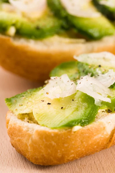 stock image Sandwich with avocado on a wooden board