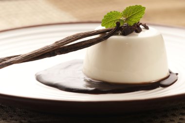 Panna Cotta with chocolate and vanilla beans clipart