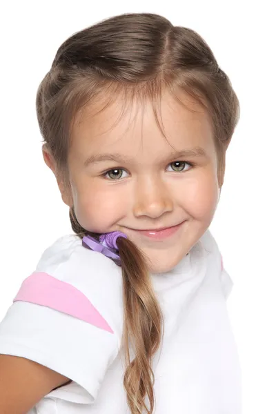 小さな学校の女の子。白い背景の上の肖像画 — ストック写真