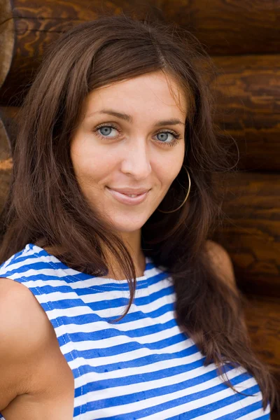 Brunette in a striped shirt — Stock Photo, Image