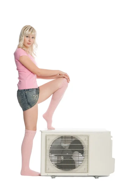 Beautiful girl with the air conditioner. — Stock Photo, Image