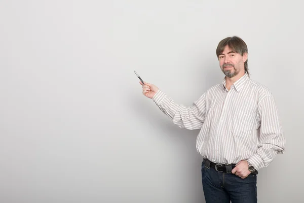 Professor sobre o fundo de uma parede cinza — Fotografia de Stock
