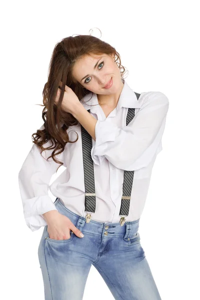 Jonge vrouw in spijkerbroek gordel met bretels. — Stockfoto