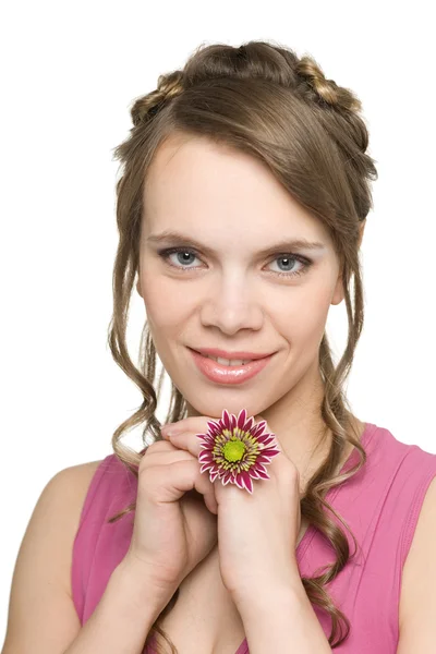 Chica sonriente con una flor — Foto de Stock