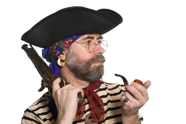 Pirate with a pipe and a musket. — Stock Photo, Image