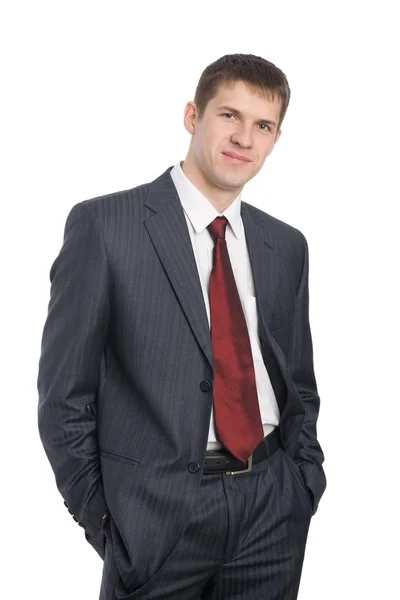 Porträt eines gut aussehenden lächelnden jungen Geschäftsmannes — Stockfoto