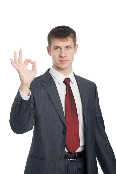 Young businessman shows gesture okay — Stock Photo, Image