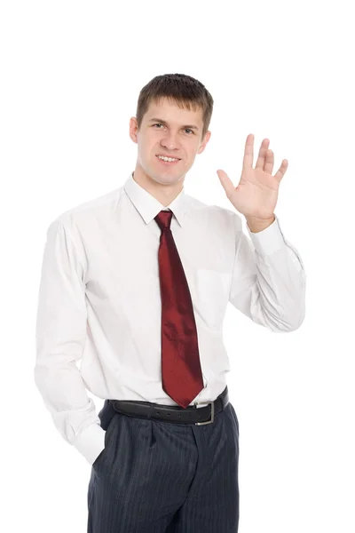Giovane uomo d'affari sorridente con un gesto di benvenuto — Foto Stock