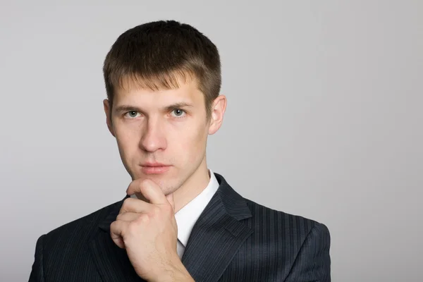 Pensive handsome young businessman — Stock Photo, Image