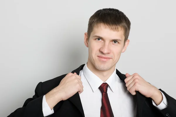 Handsome smiling young businessman. — Stock Photo, Image