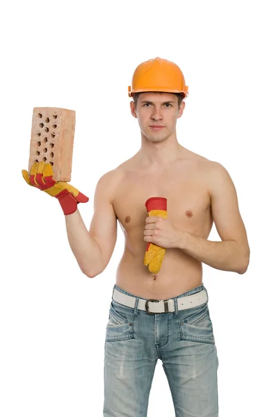 Young man with a brick in his hand — Stock Photo, Image
