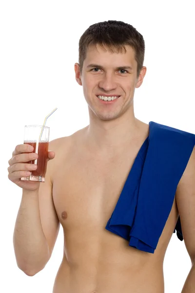 Handsome young guy drinks juice — Stock Photo, Image