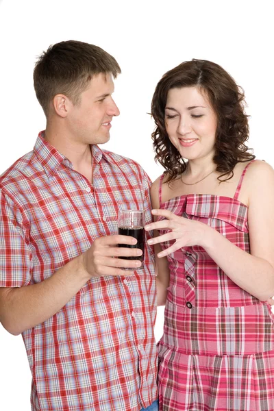 Guy treats a girl with a drink — Stock Photo, Image