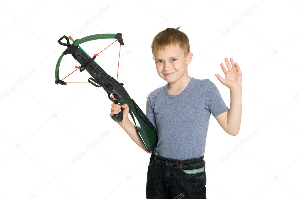 Smiling boy holding a crossbow