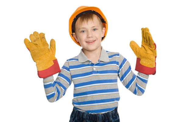 Rapaz alegre no capacete de construção — Fotografia de Stock