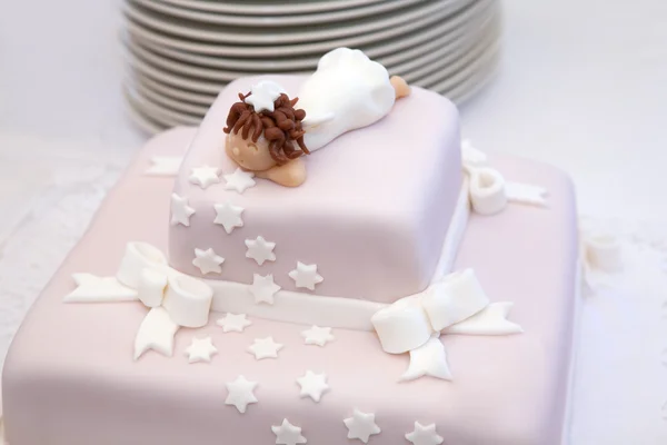 Pink christening cake with little angel on top — Stock Photo, Image