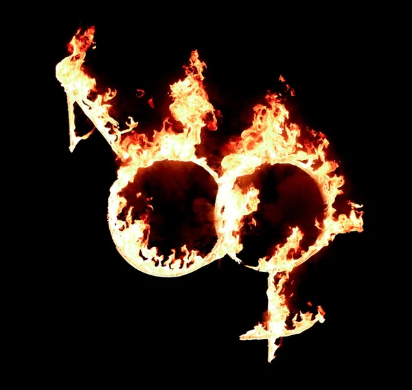 Vrouwelijke en mannelijke symbolen in brand — Stockfoto
