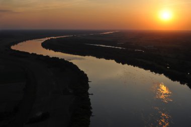 River at sunset seen from a bird's eye clipart