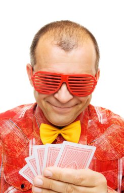 Gambler holding playing cards and smiling clipart