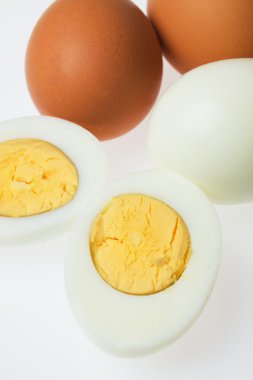 Hard boiled eggs on white background clipart