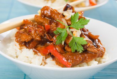 Asian style pork meat with rice clipart