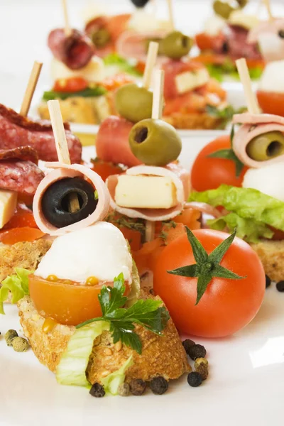 Bruschetta bread with olive, cheese and tomato — Stock Photo, Image