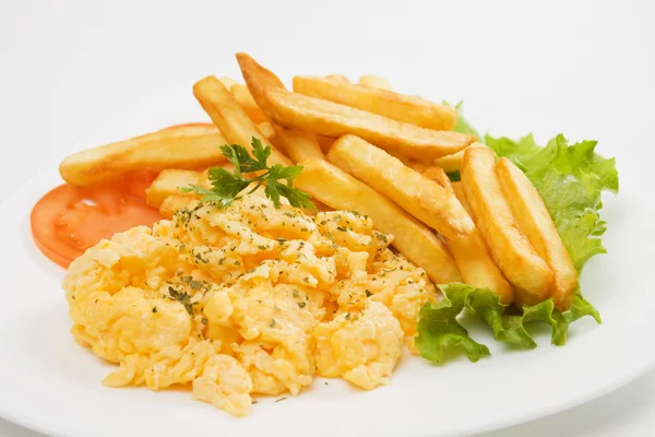 scrambled eggs and french fries - 圖庫照片