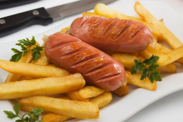Fried sausage with french fries — Stock Photo, Image